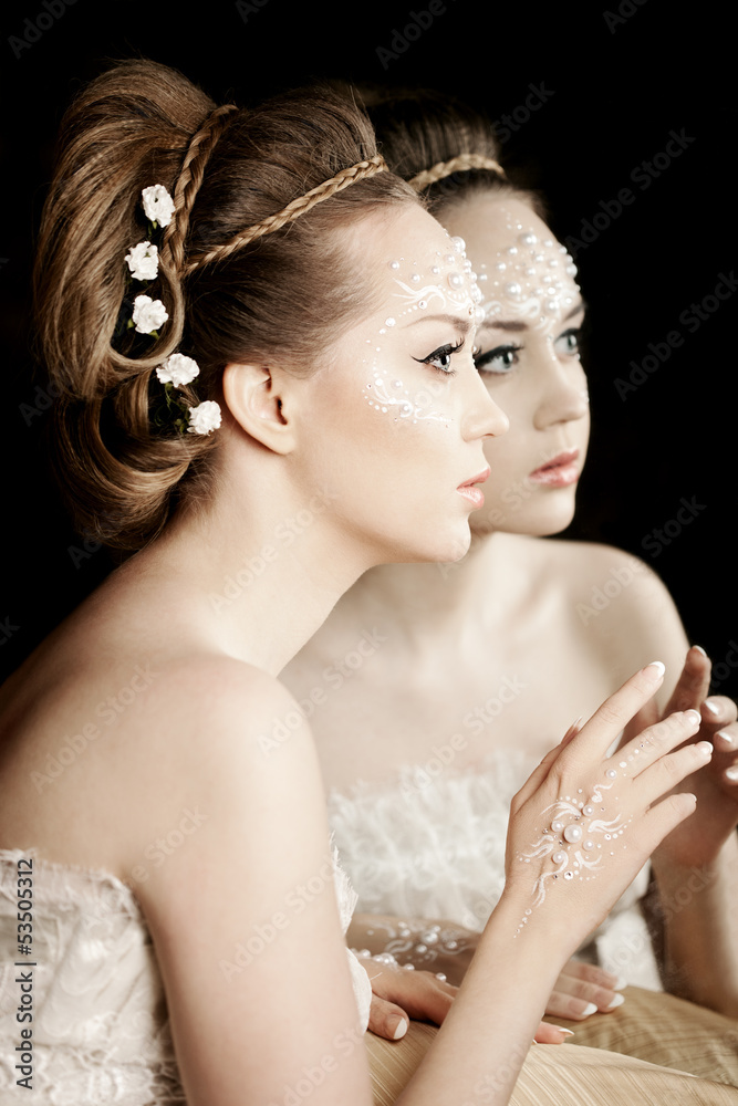 Woman with creative make-up of pearls