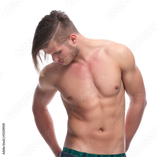 topless fashion man with hands in bac pockets