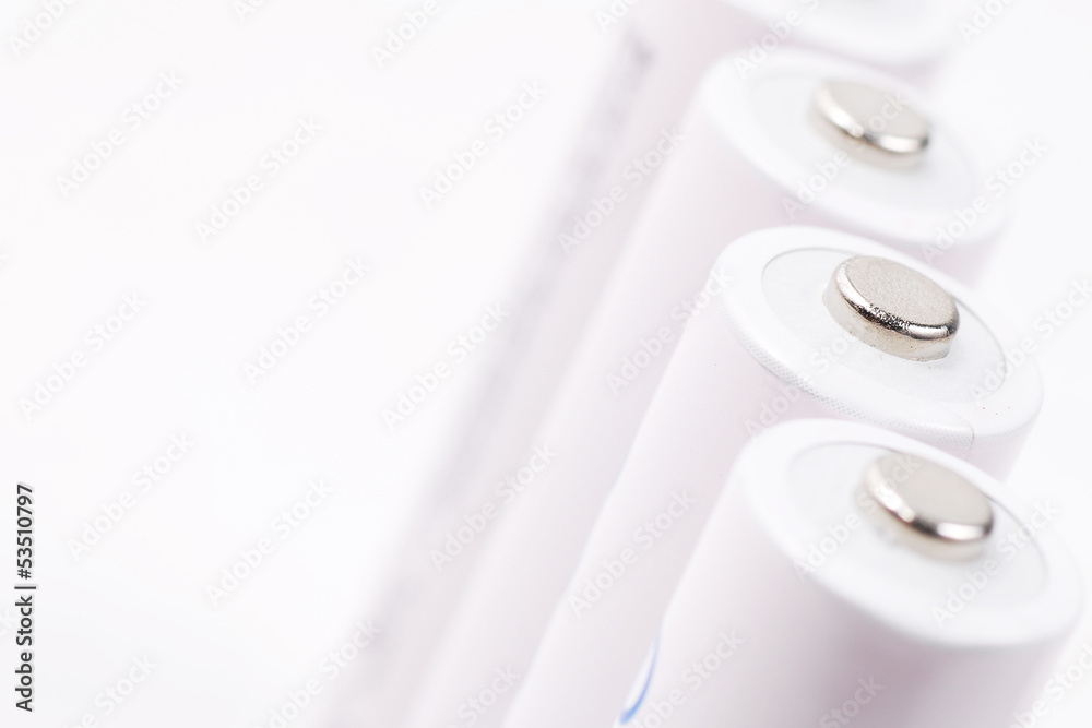 close-up of white cell batteries on isolated white background close-up of white cell batteries on isolated white background