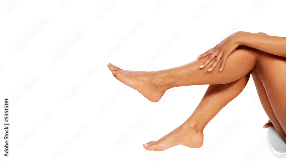 Beautiful female legs isolated over white background.Beauty and Beautiful female legs isolated over white background.Beauty and