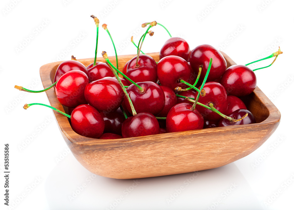 cherry berry in wooden bowl, isolated on white background cherry berry in wooden bowl, isolated on white background