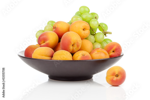 Apricots fruit on a bowl  isolated on white background