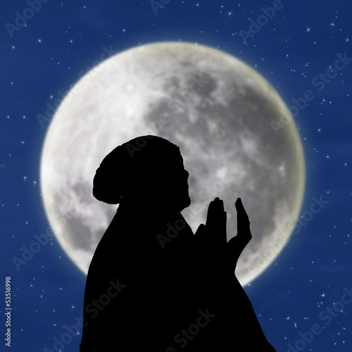 Canvas Print Silhouette of female muslim on blue moon