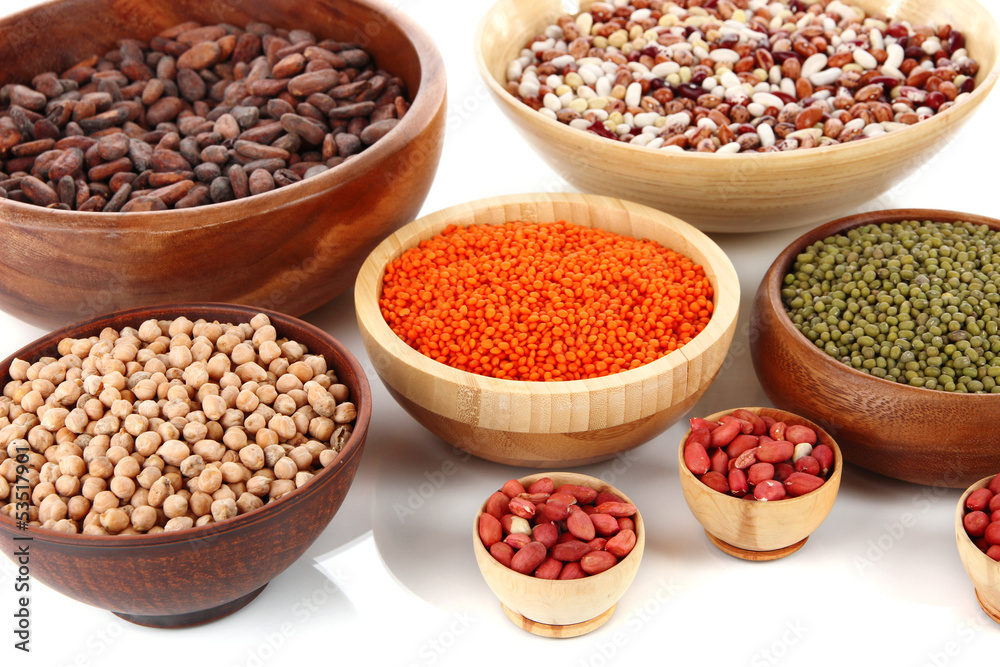 Different kinds of beans in bowls isolated on white Different kinds of beans in bowls isolated on white