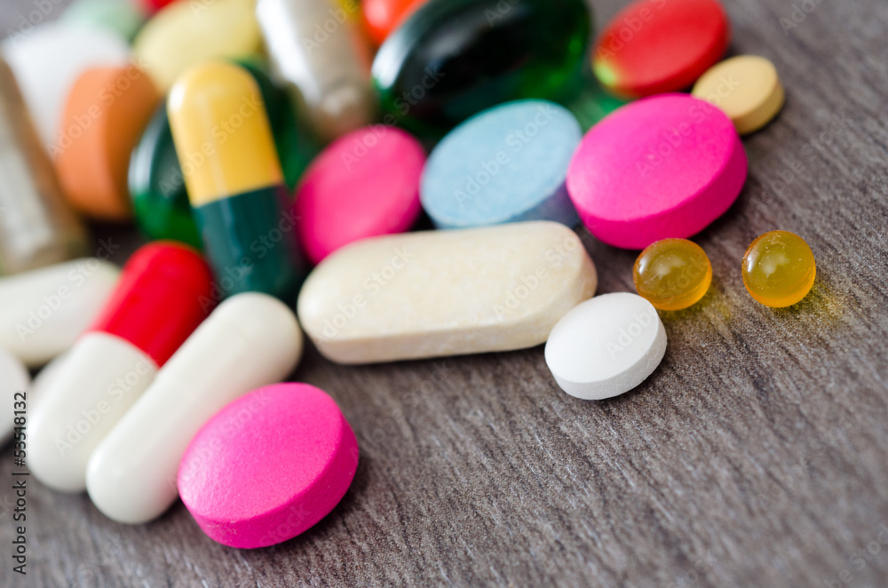 Assorted pills on the table Assorted pills on the table