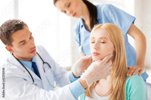 male plastic surgeon with patient