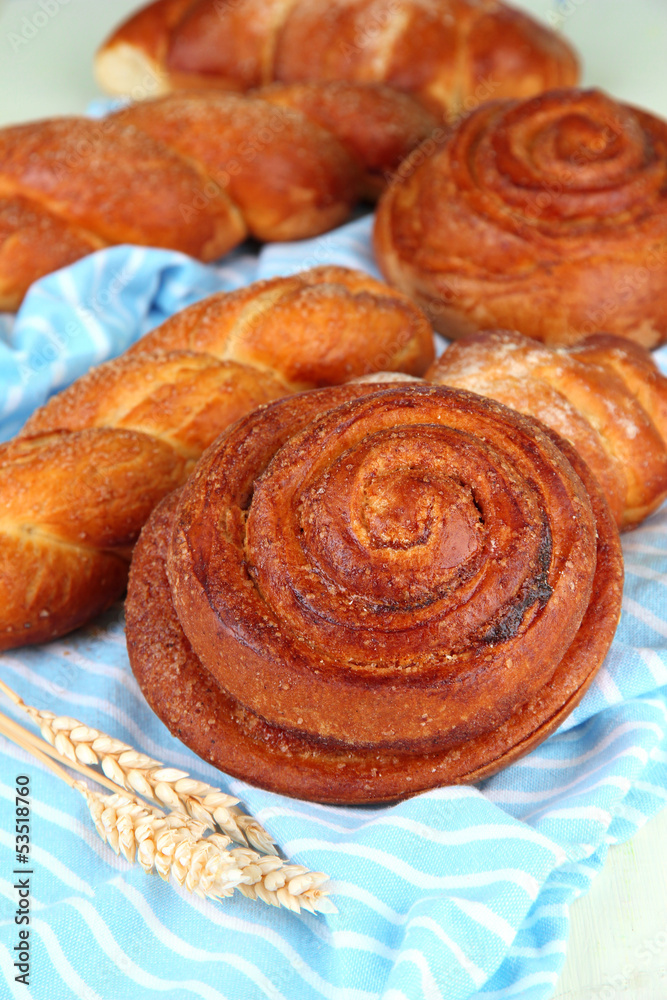 Fototapeta premium Composition with buns, on color napkin, close up