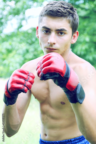 Kickboxer in red gloves photo