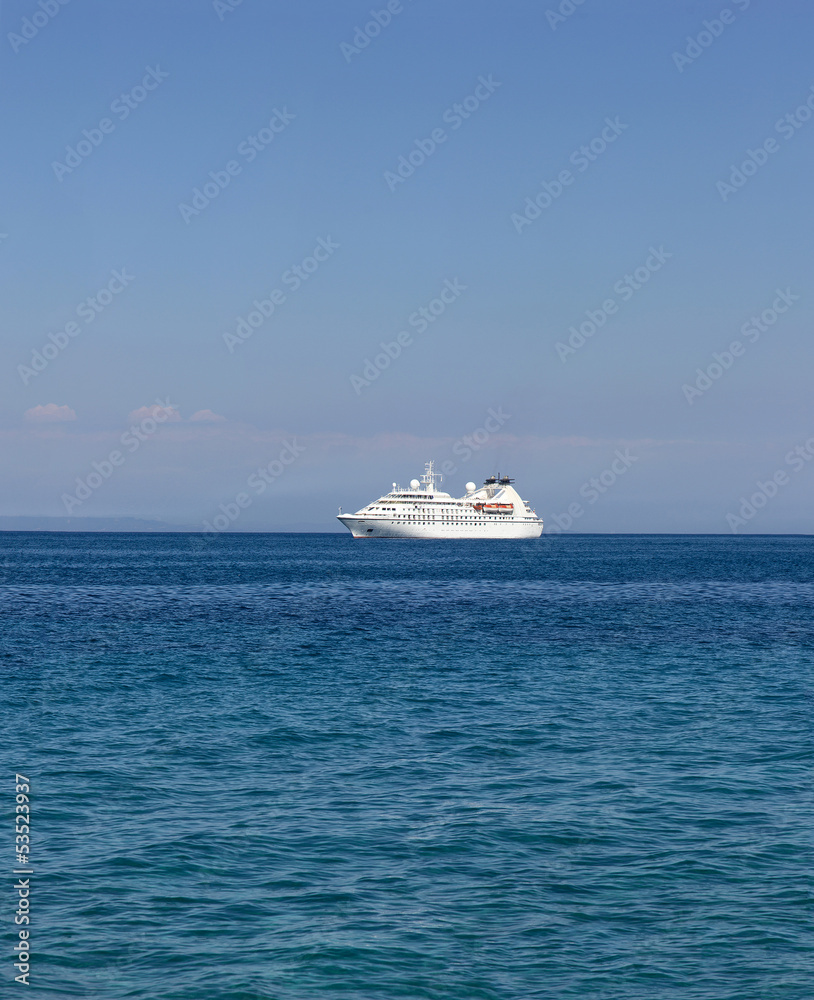 cruise ship traveling in the blue sea