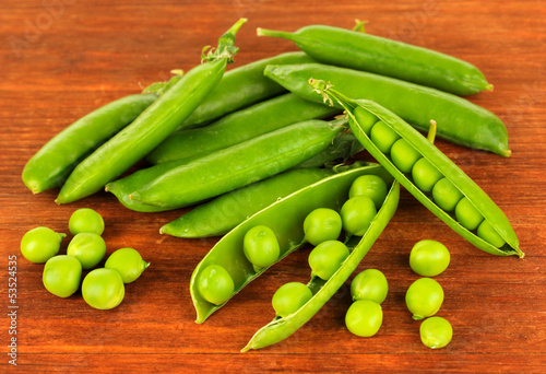 Sweet green peas on wooden background