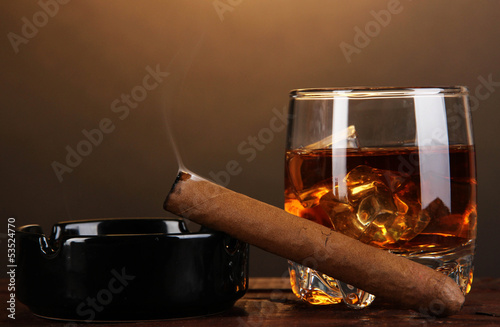 Fotografie Brandy glass with ice and cigar
