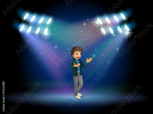 A teenager in the middle of the stage