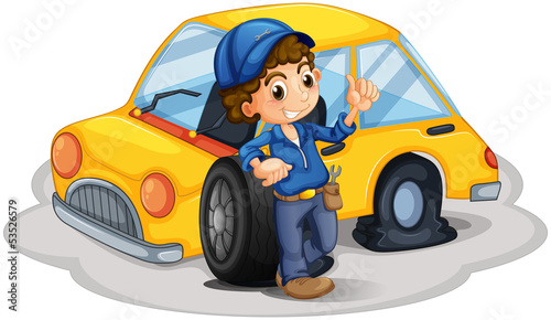 A male mechanic fixing the yellow car
