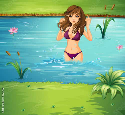 A girl swimming at the pond