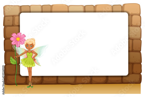 A fairy holding a giant flower beside an empty blankboard on a w