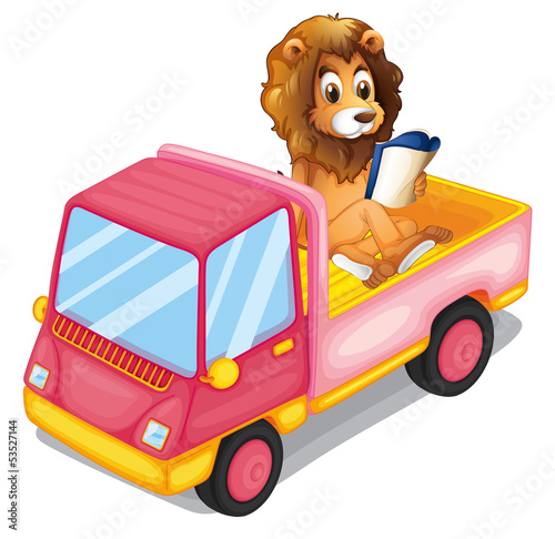 A lion reading a book at the back of a truck