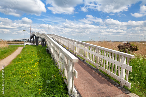 long white bridge over river, Alkmaar © Olha Rohulya