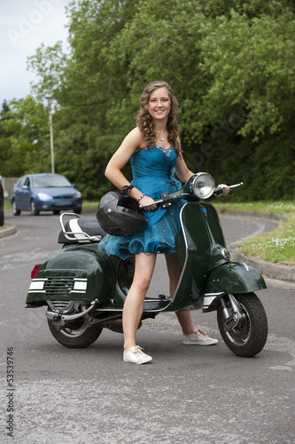 Teenage girl with her motor scooter