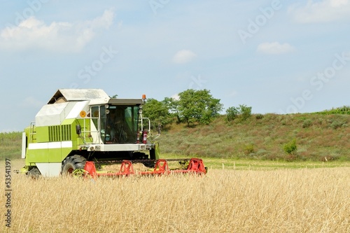 Combine harvester in the field during harvesting