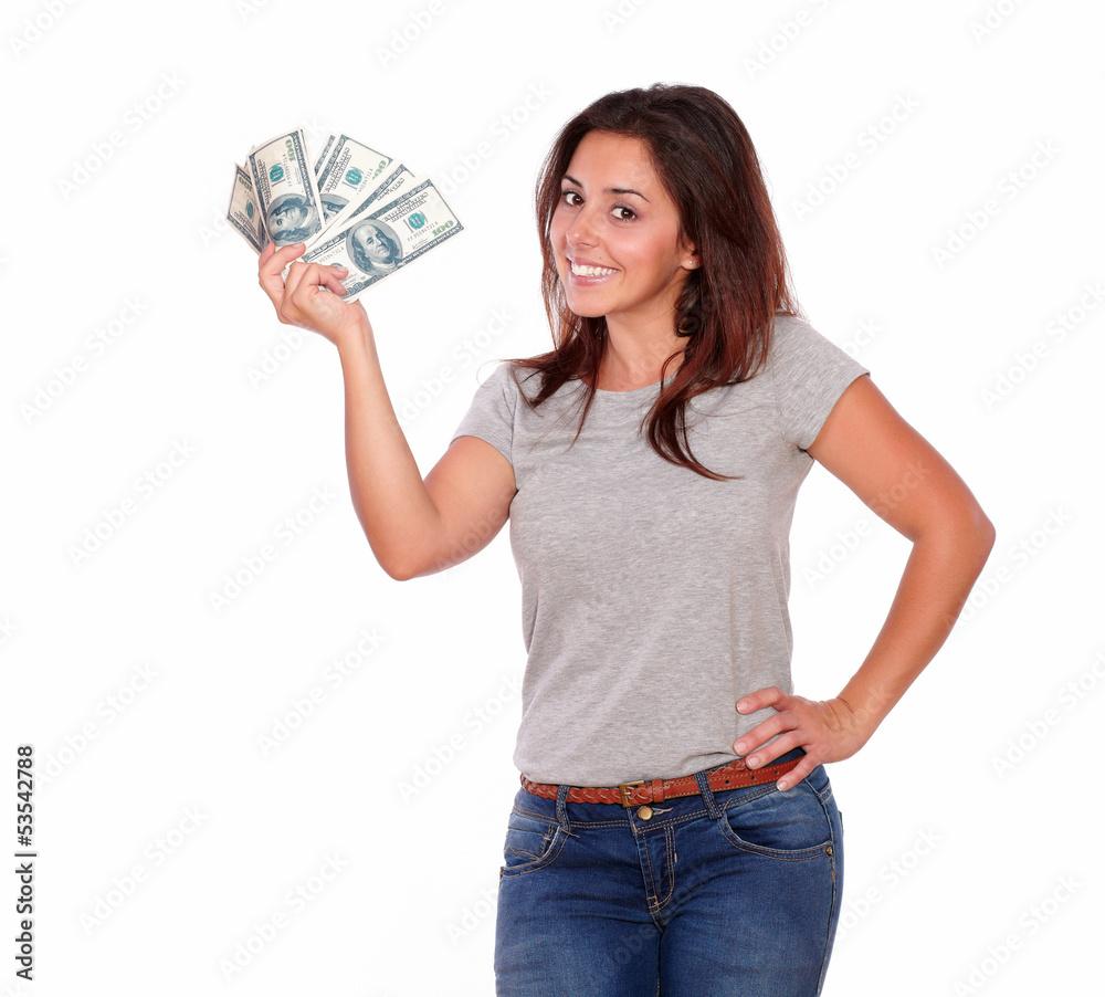 Cute smiling lady holding dollars while standing Cute smiling lady holding dollars while standing