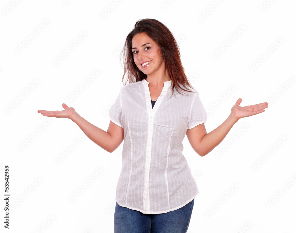Smiling hispanic young woman holding palms out Smiling hispanic young woman holding palms out