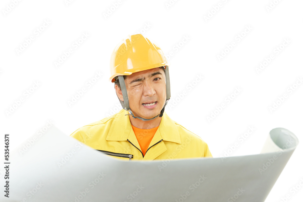疲れた表情の作業員 疲れた表情の作業員