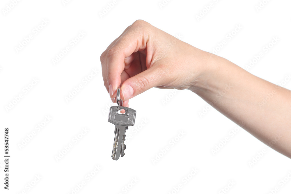 Side view of home keys hanging from a woman hand Side view of home keys hanging from a woman hand