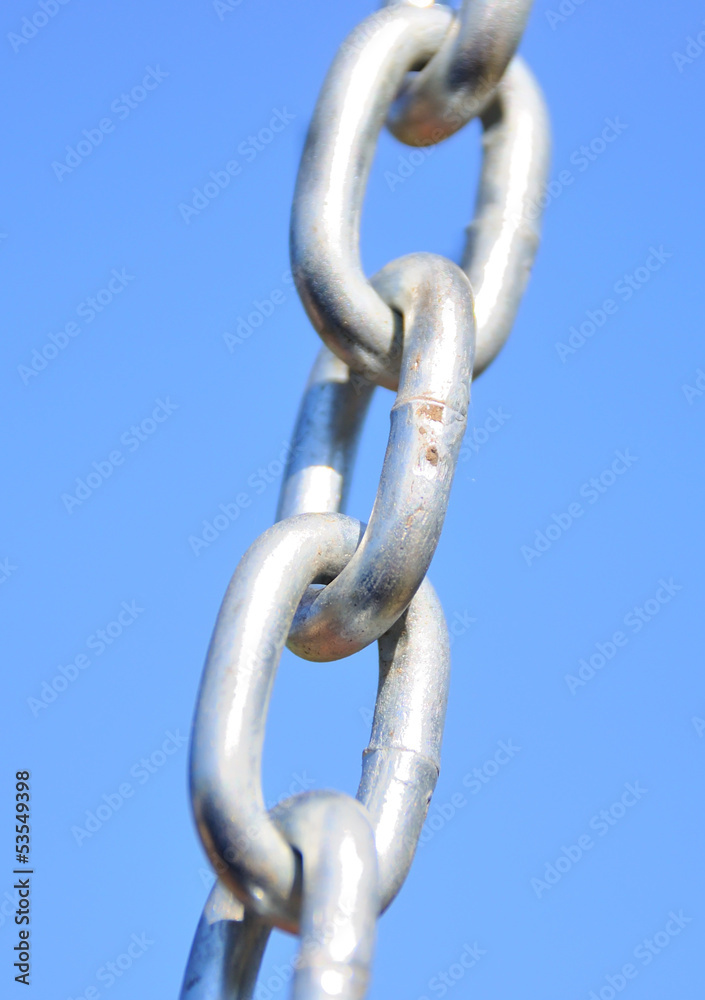 Chain Links - Shows a closeup of a metal chain link segment from Chain Links - Shows a closeup of a metal chain link segment from