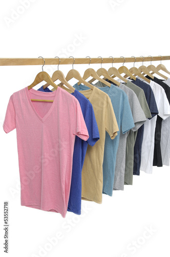 man clothes of different colors shirt on wooden hangers