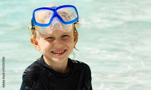 Cute young boy wearing mask