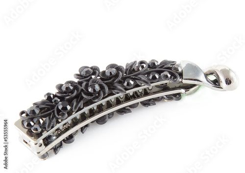 Black isolated barrette over white background. Fashion, object
