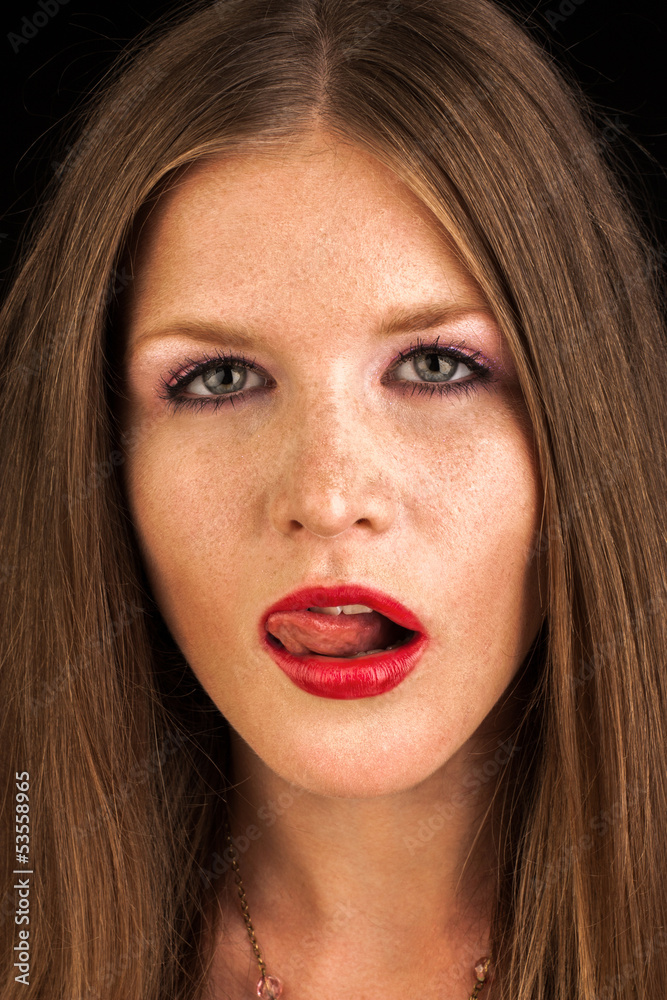 sexy fashion girl with red lipstick lick her lips with tongue