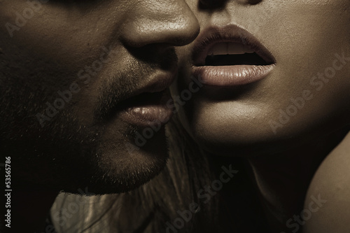 Cuadro en lienzo Young man with perfect facial hair and sensual lips of a woman