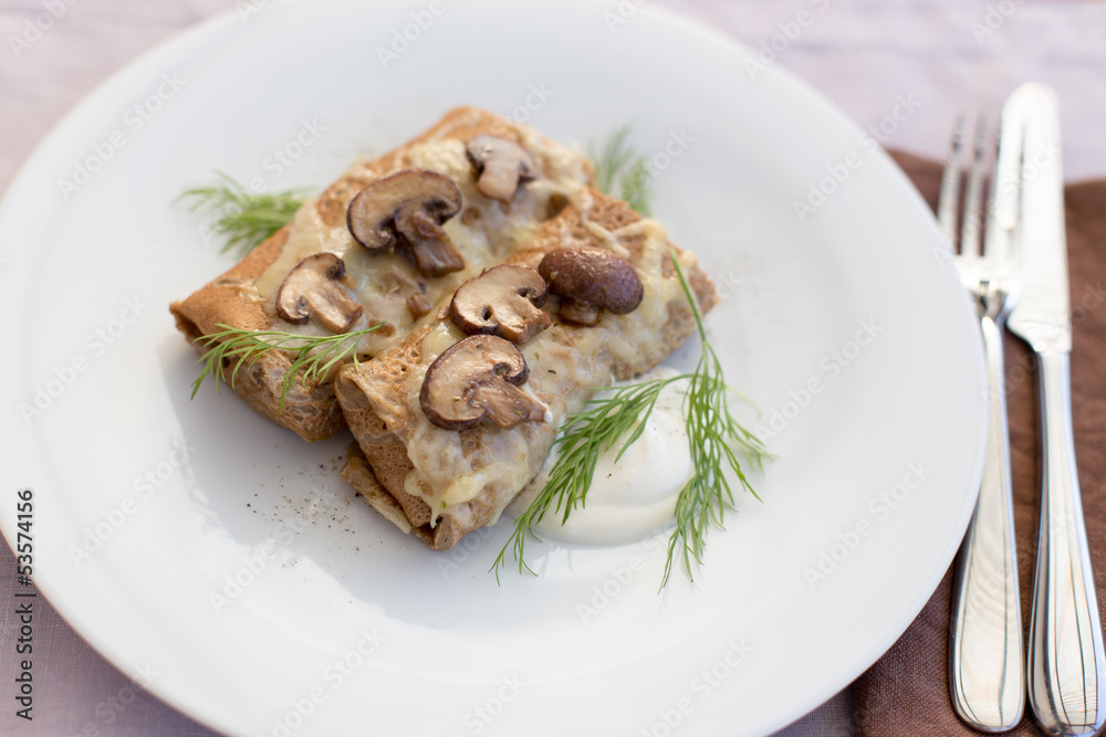Tasty salty pancakes with mushrooms Tasty salty pancakes with mushrooms