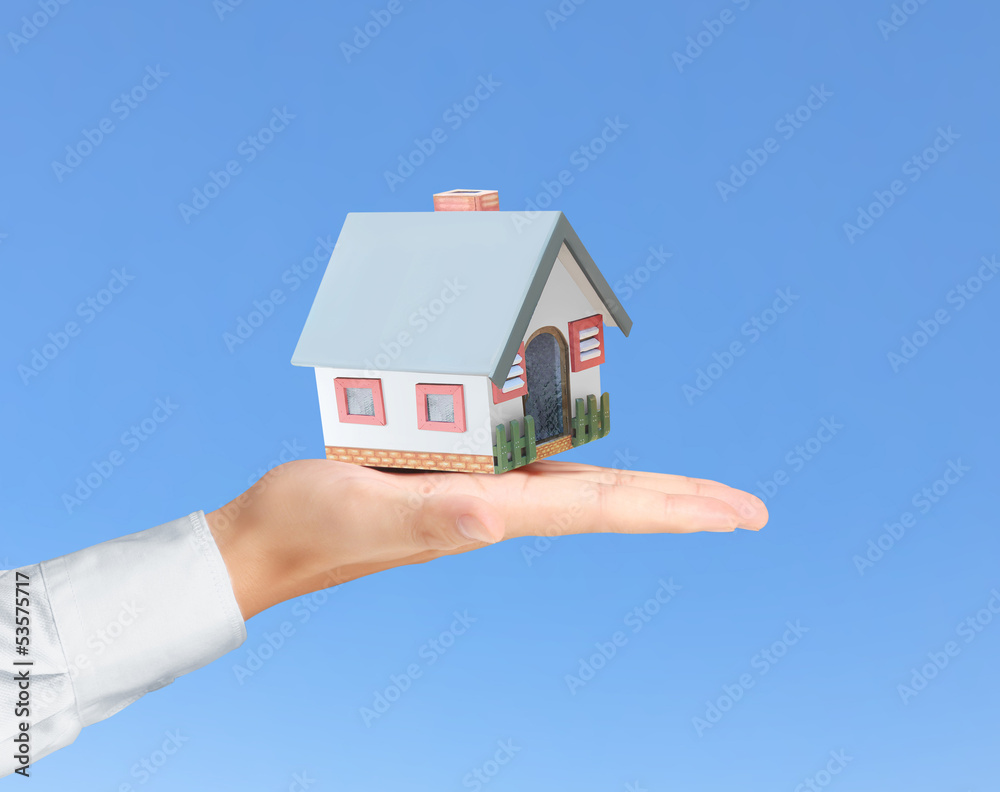 holding house representing home ownership holding house representing home ownership
