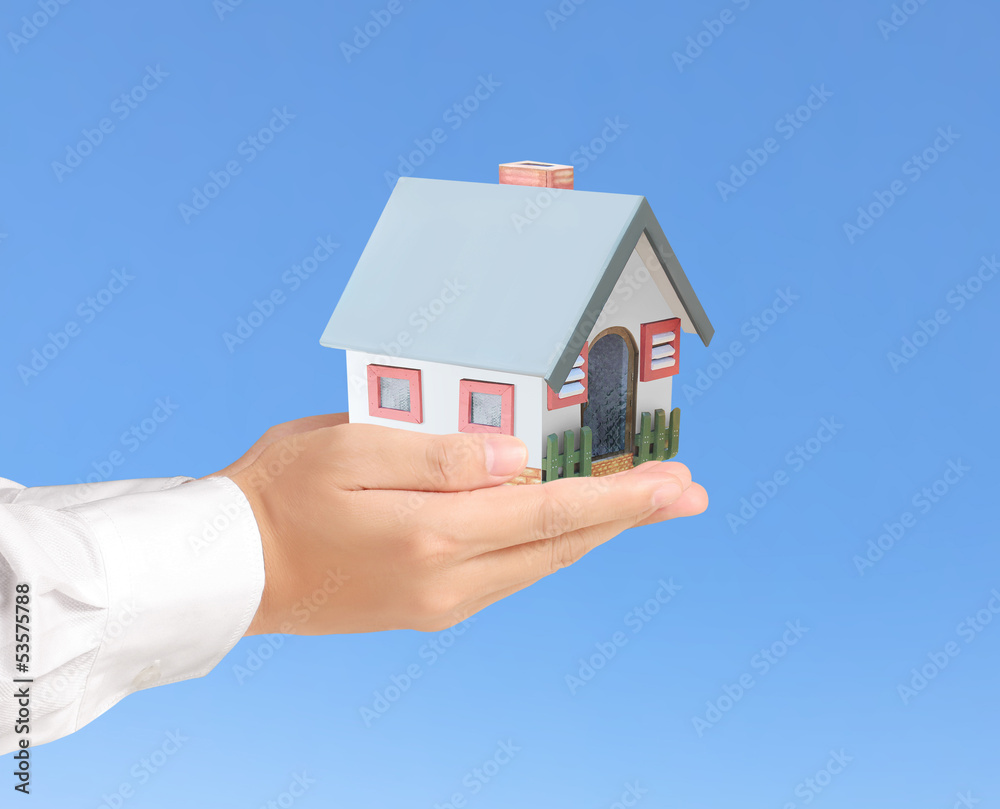 holding house representing home ownership holding house representing home ownership