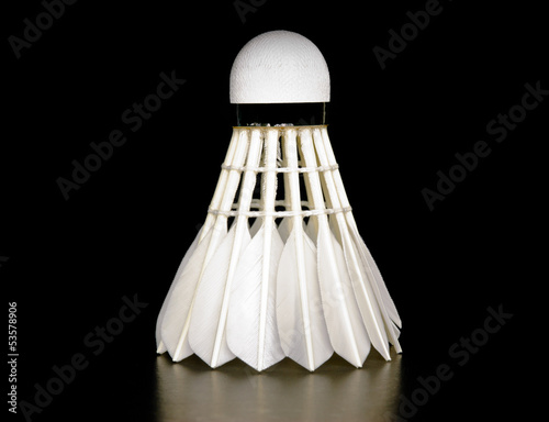 Foto Feather shuttlecock isolated on black background