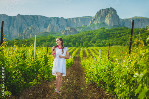 Beautiful girl  in summer vineyard © elina_lava