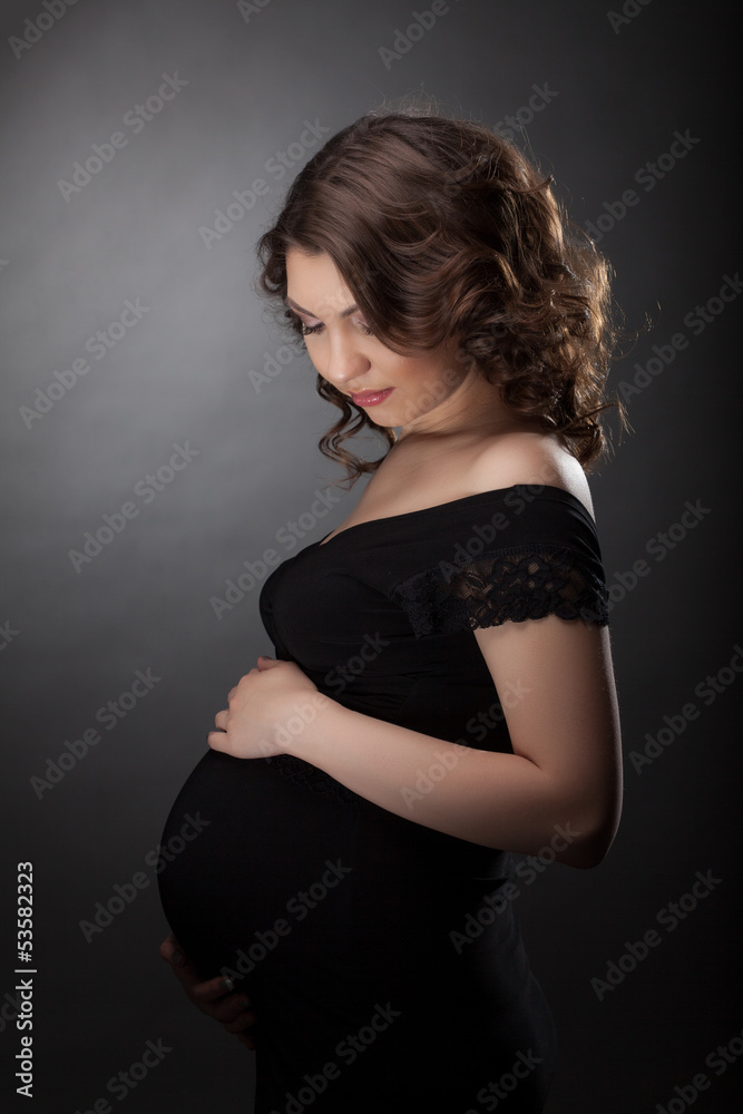 Beautiful pregnant woman in black dress Beautiful pregnant woman in black dress