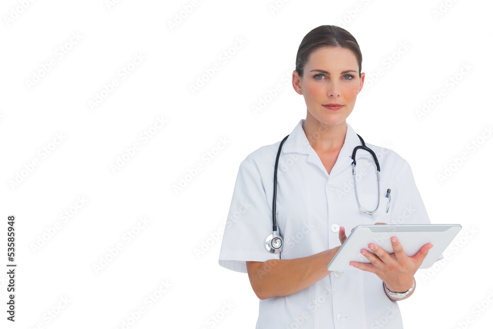 Cheerful nurse using her tablet Cheerful nurse using her tablet