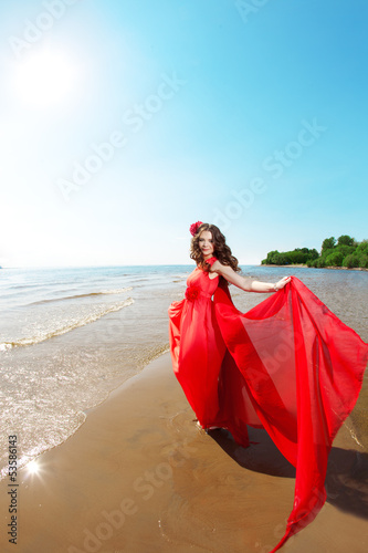Beautiful woman in a bright red dress