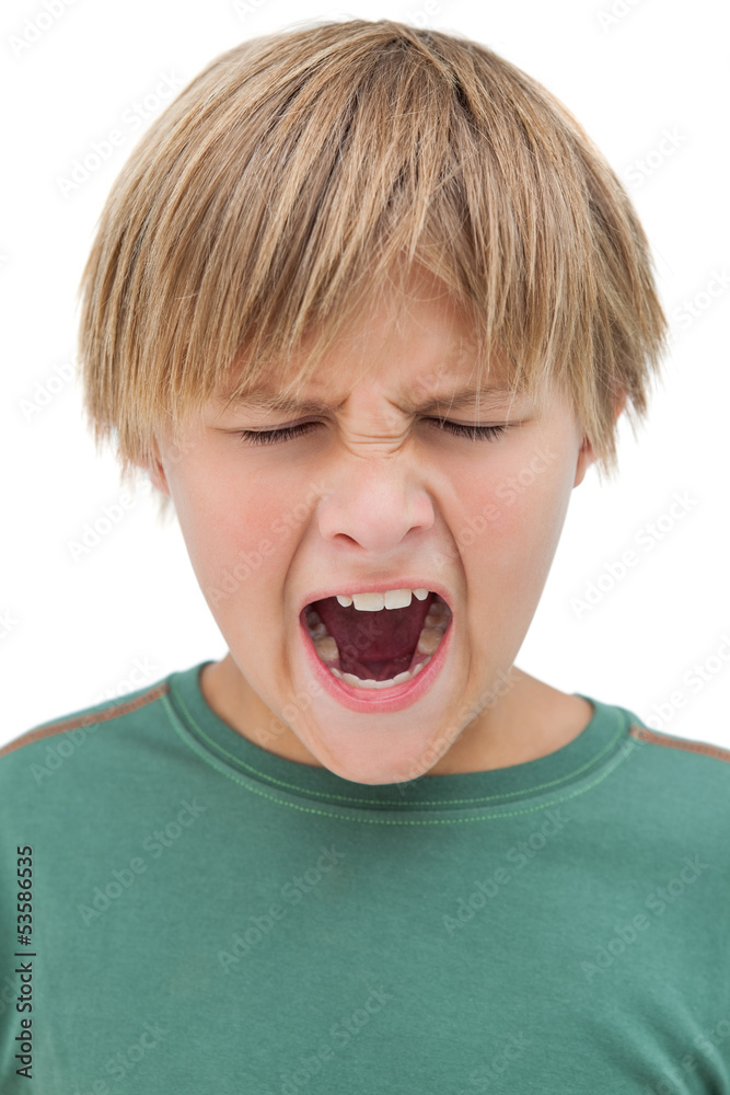 Furious little boy shouting with eyes closed Furious little boy shouting with eyes closed