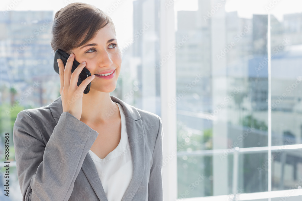 Businesswoman smiling and calling on phone Businesswoman smiling and calling on phone