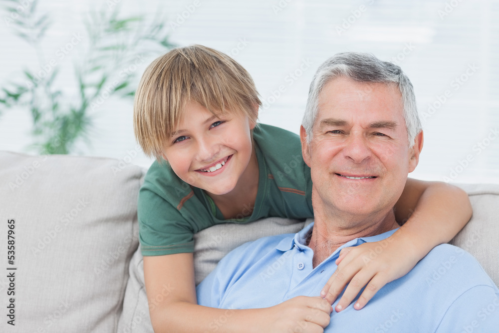 Portrait of grandson embracing grandfather Portrait of grandson embracing grandfather
