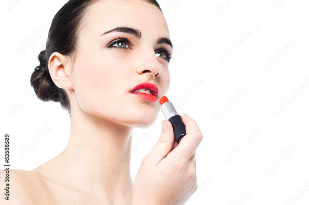 Portrait of beautiful girl applying lipstick Portrait of beautiful girl applying lipstick