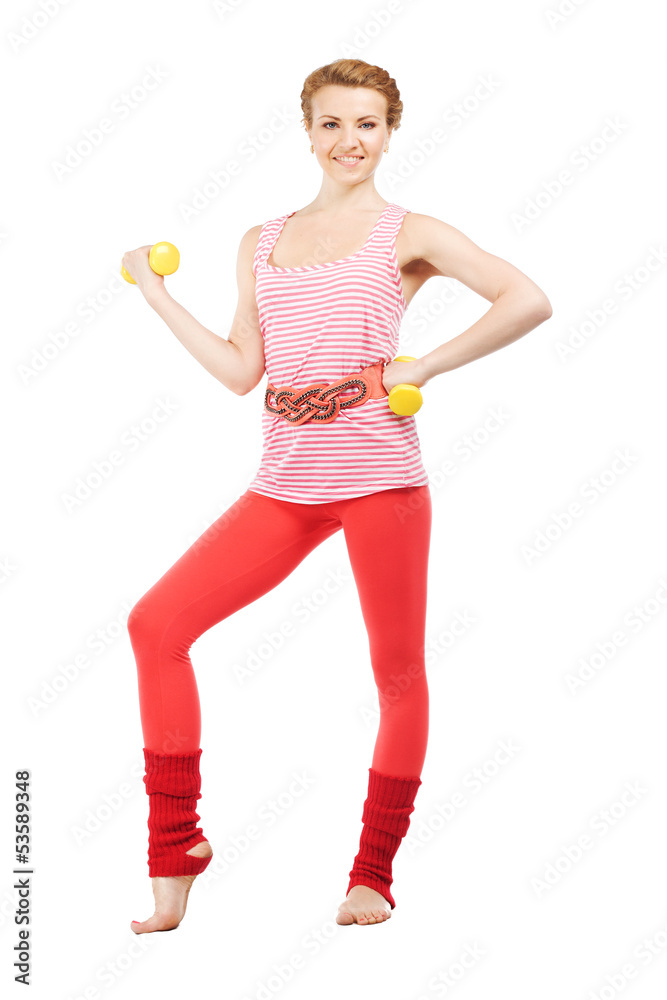 Beautiful sporty woman doing exercise with dumbbells