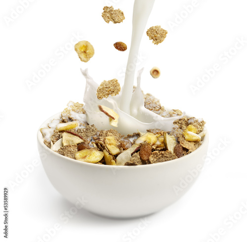 Pouring milk into a bowl with breakfast cereal