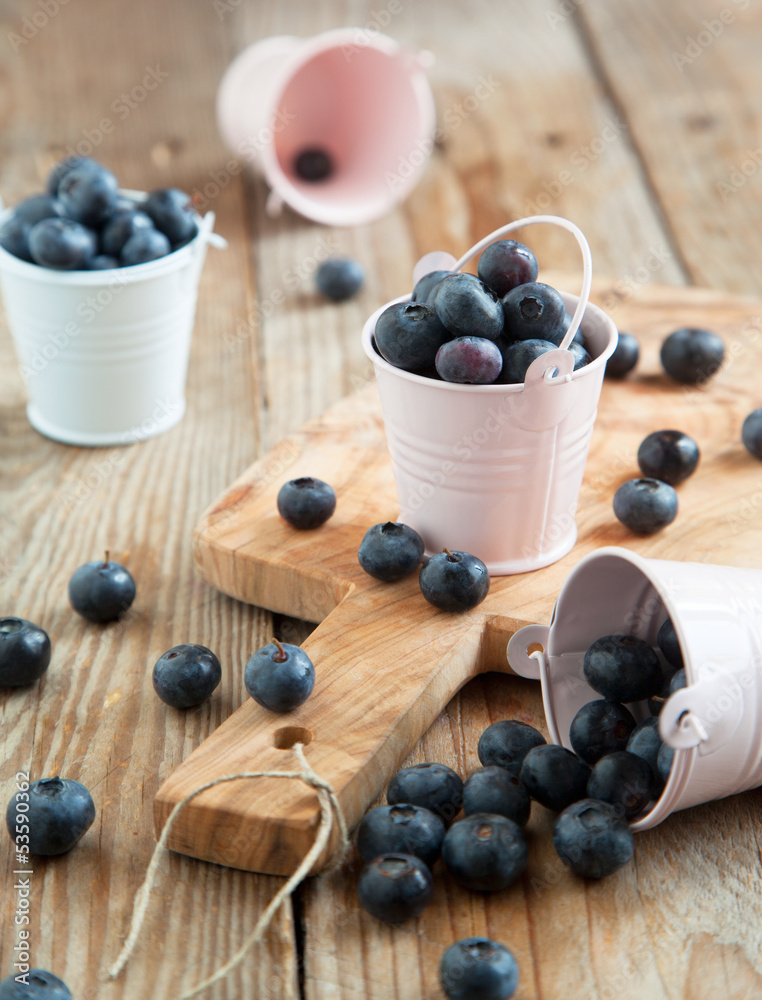 Fresh blueberries in small bucket. Selective focus Fresh blueberries in small bucket. Selective focus