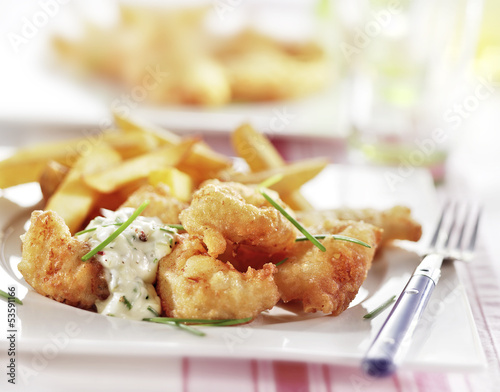 fish and chips served on a plate