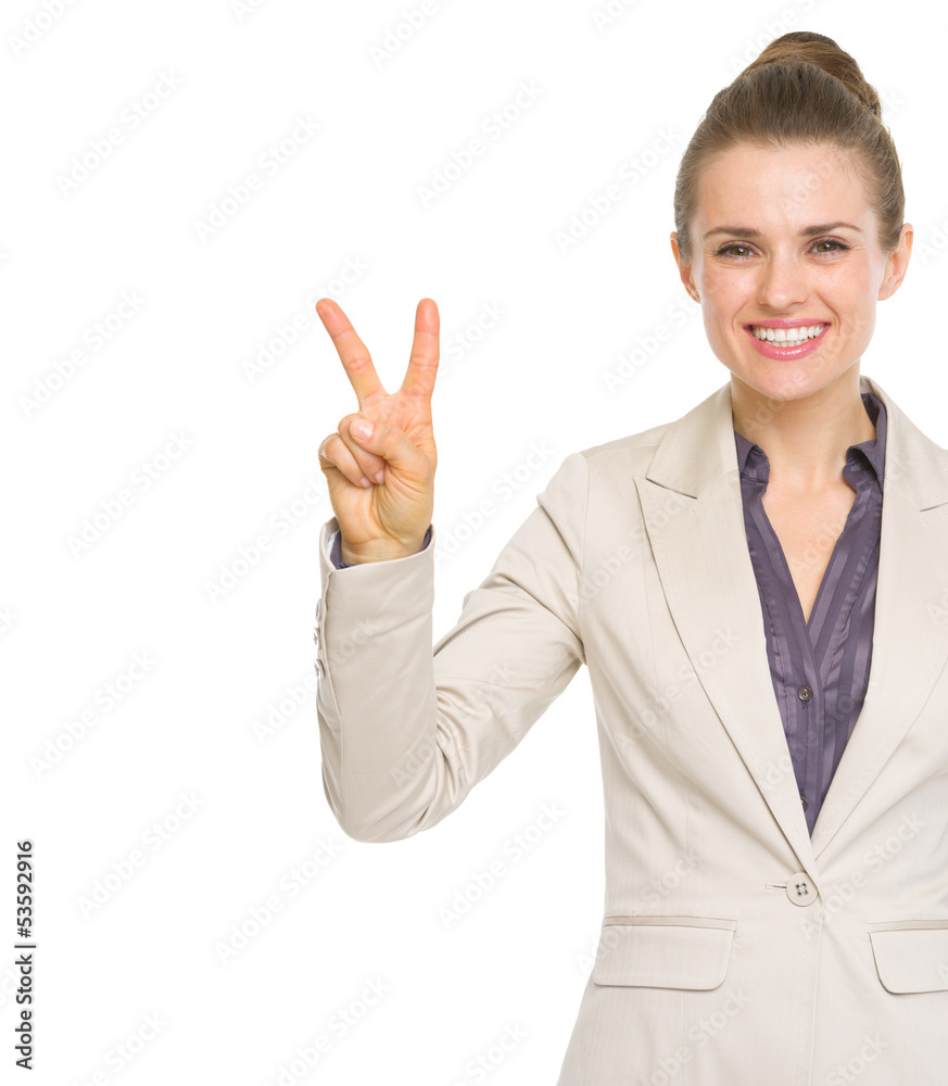 Happy business woman showing victory gesture Happy business woman showing victory gesture